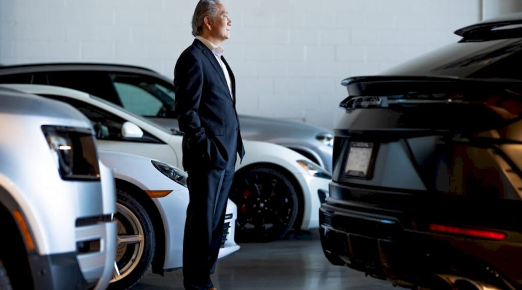 Businessman with luxury car in downtown Vancouver